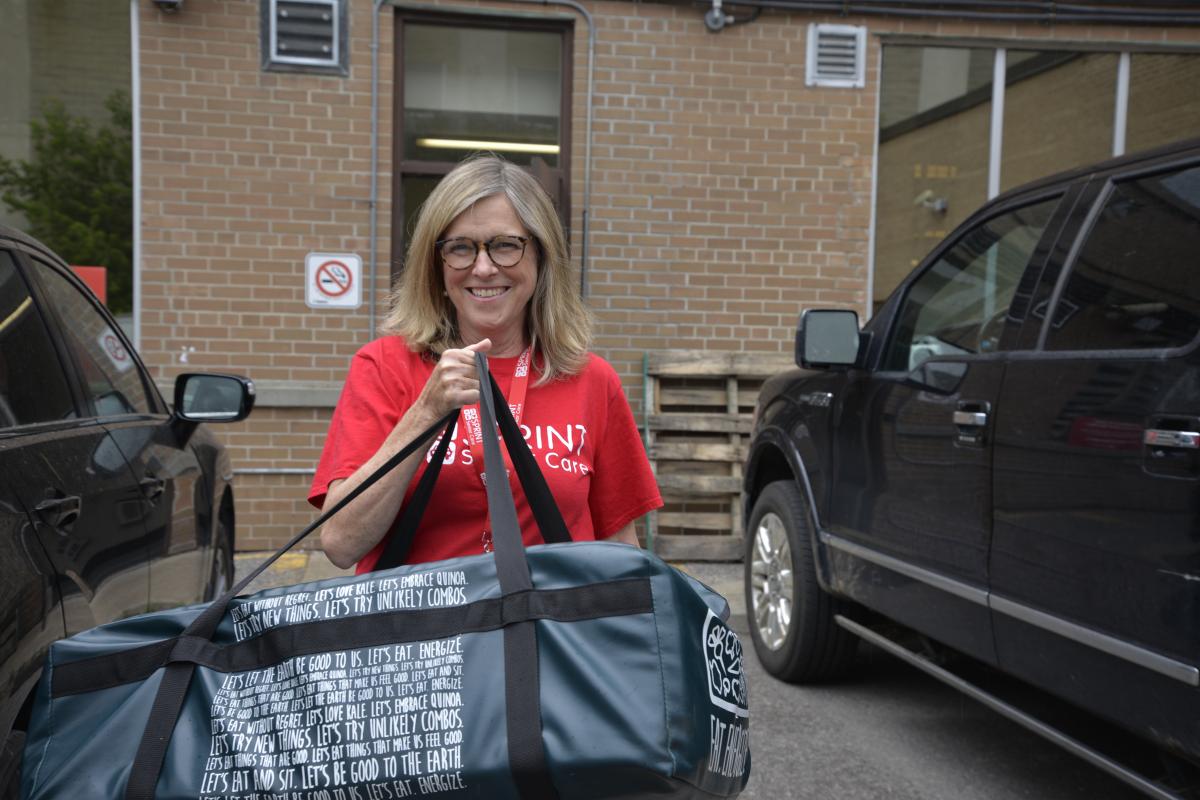 smiling worker carrying delivery