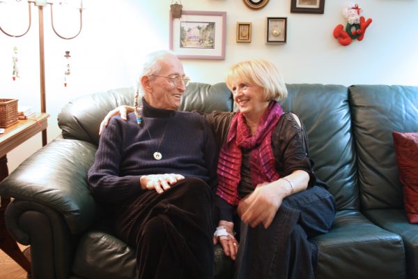 Caregiver and Client sitting of sofa