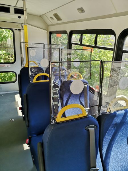 bus with plastic screens between seats