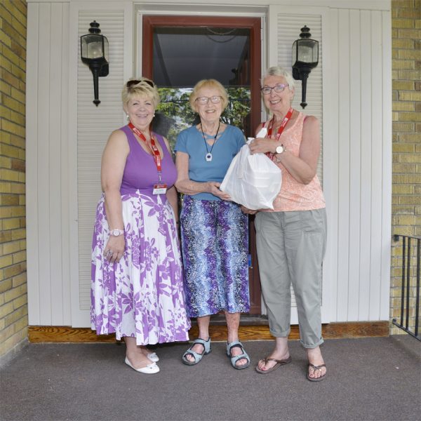 Ladies on Porch with gift package